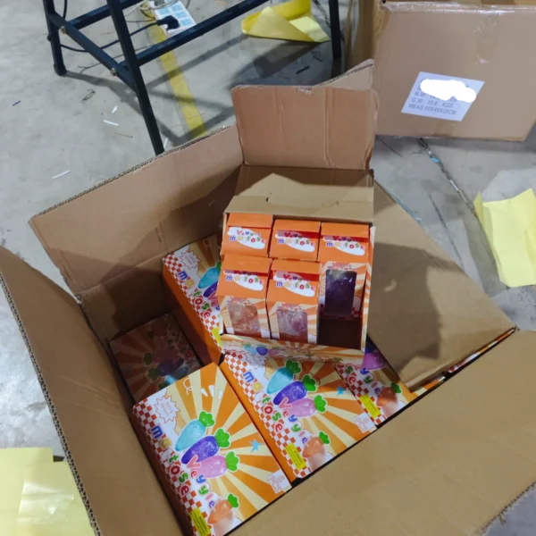 Warehouse quality inspection checking product labels inside and outside packaging