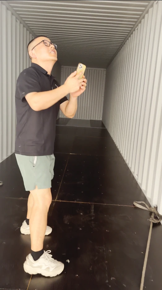 Warehouse supervisor checking container before loading cargo