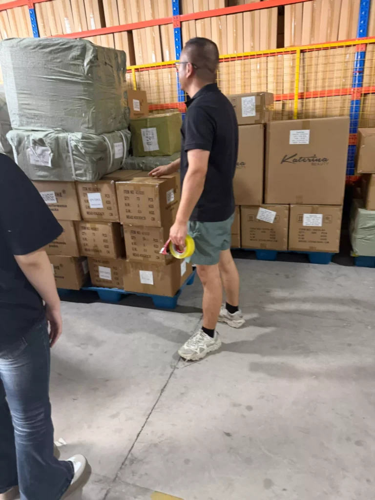 Warehouse supervisor planning cargo placement before container loading