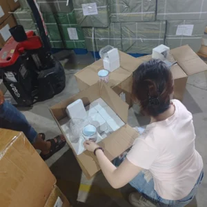 Staff checking products after supplier delivery at a China warehouse
