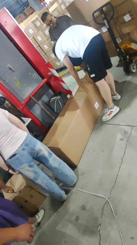 Supplier confirming products with warehouse staff in China