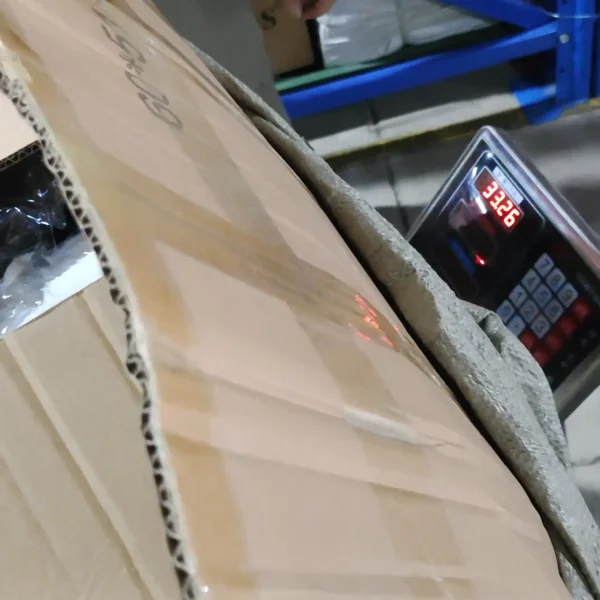 Full carton of panda hats weighing 33.26 kg on a digital scale