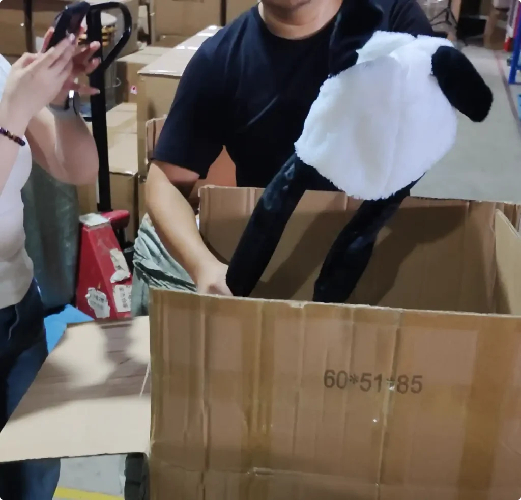 Supplier demonstrating the moving-ear function of a panda hat