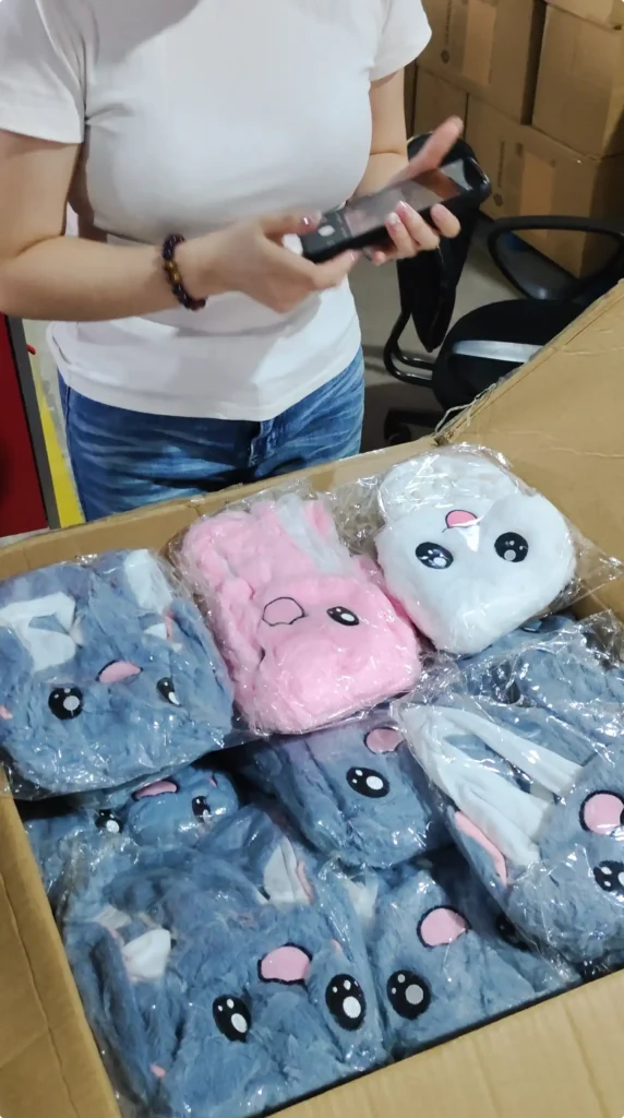 Three colors of moving-ear bunny hats lined up for inspection