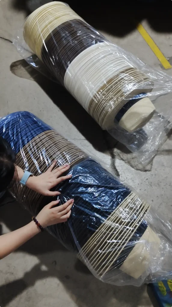 Warehouse team counting British-style hats during inspection